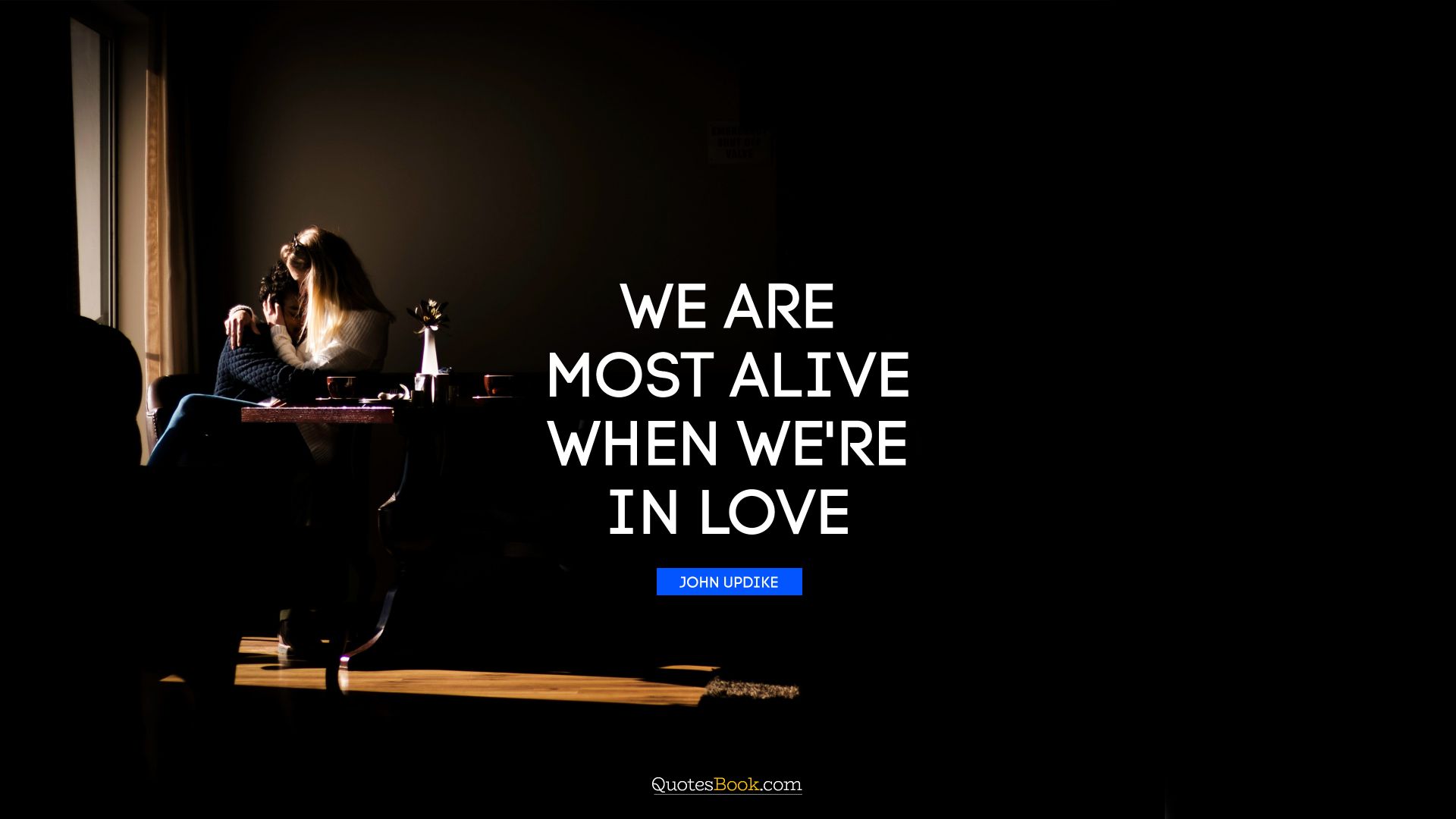We are most alive when we're in love. - Quote by John Updike